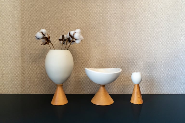 Stylish Interior Decor Featuring Modern Minimalist Ceramic Vases and Bowls with Wooden Bases and Dried Cotton Flowers